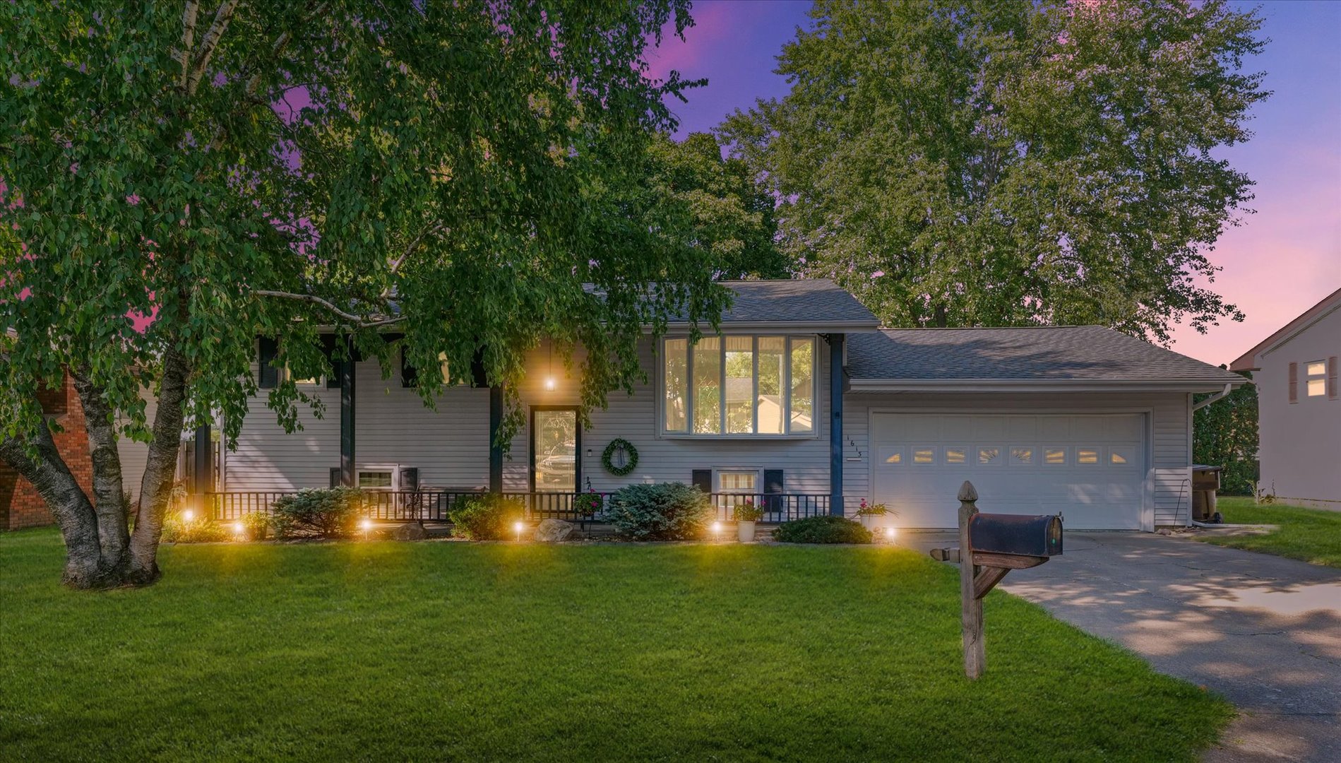 1613 Carolina Drive Rantoul, IL 61866 - Photo 3 of 50 a front view of a house with a garden