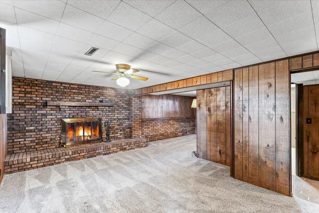 a view of an empty room with a fireplace