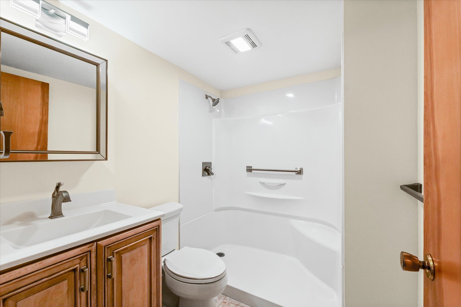 1613 Carolina Drive Rantoul, IL 61866 - Photo 38 of 50 a bathroom with a sink a toilet and shower