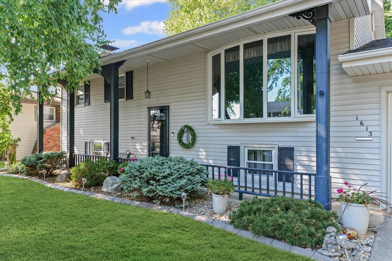 1613 Carolina Drive Rantoul, IL 61866 - Photo 7 of 50 a view of a backyard with plants and large tree