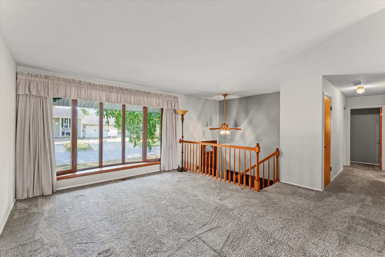 1613 Carolina Drive Rantoul, IL 61866 - Photo 8 of 50 a view of an empty room with a balcony