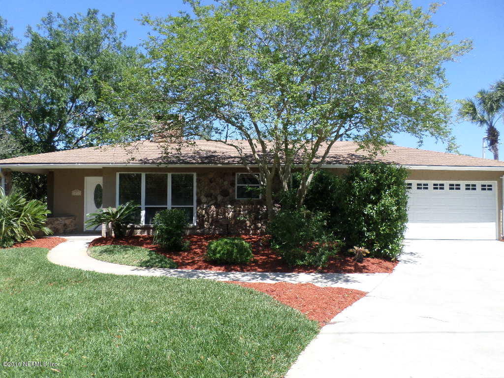 4237 Stacey Road Jacksonville, FL 32250 - Photo 1 of 22 a front view of a house with sitting space and garden