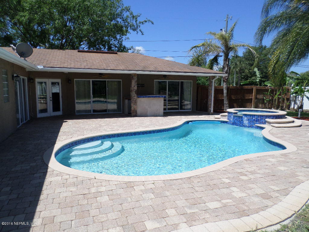 4237 Stacey Road Jacksonville, FL 32250 - Photo 16 of 22 a view of a house with swimming pool and porch