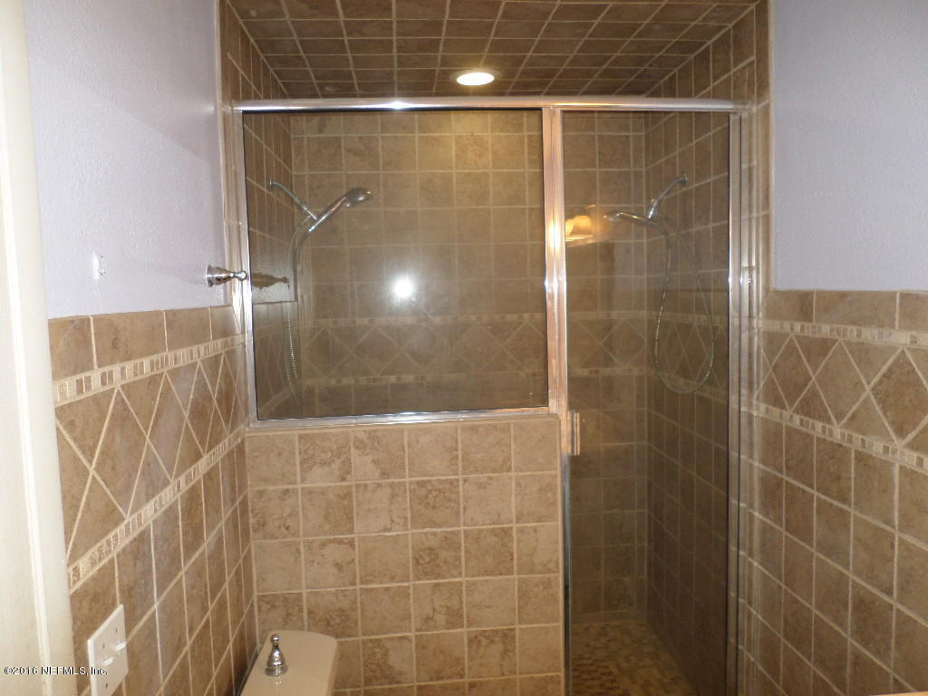 4237 Stacey Road Jacksonville, FL 32250 - Photo 17 of 22 a bathroom with a shower