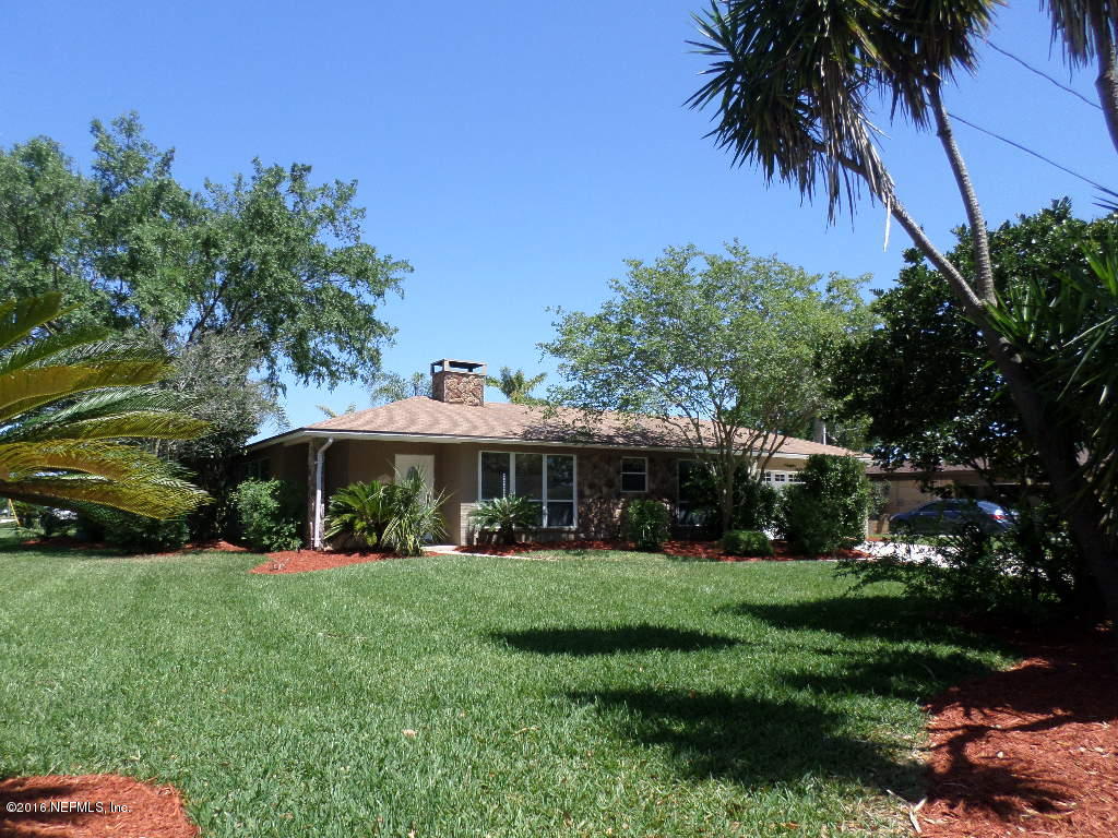 4237 Stacey Road Jacksonville, FL 32250 - Photo 22 of 22 a front view of a house with a yard