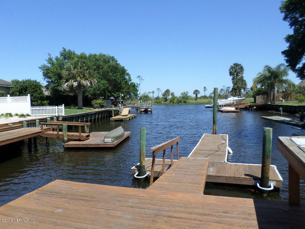 4237 Stacey Road Jacksonville, FL 32250 - Photo 3 of 22 a view of a lake with boats and trees in the background