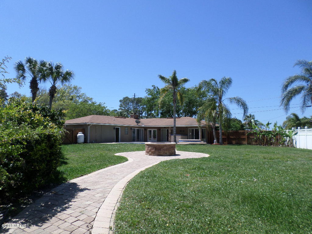 4237 Stacey Road Jacksonville, FL 32250 - Photo 5 of 22 a view of a backyard with a garden and plants