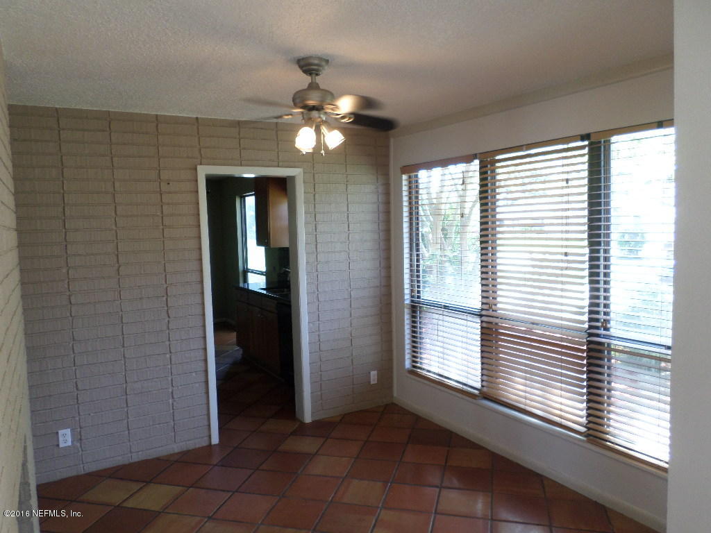 4237 Stacey Road Jacksonville, FL 32250 - Photo 7 of 22 a view of an empty room with a window