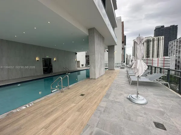 a lobby with furniture and a floor to ceiling window