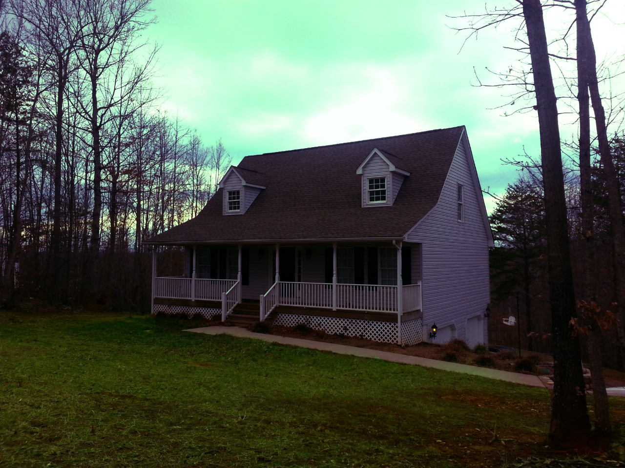 front view of a house with a garden