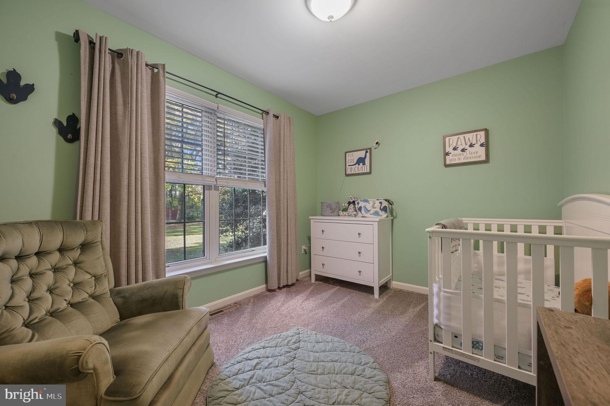 196 Mifflin Road Dover, DE 19904 - Photo 15 of 27 a bedroom with furniture and a window