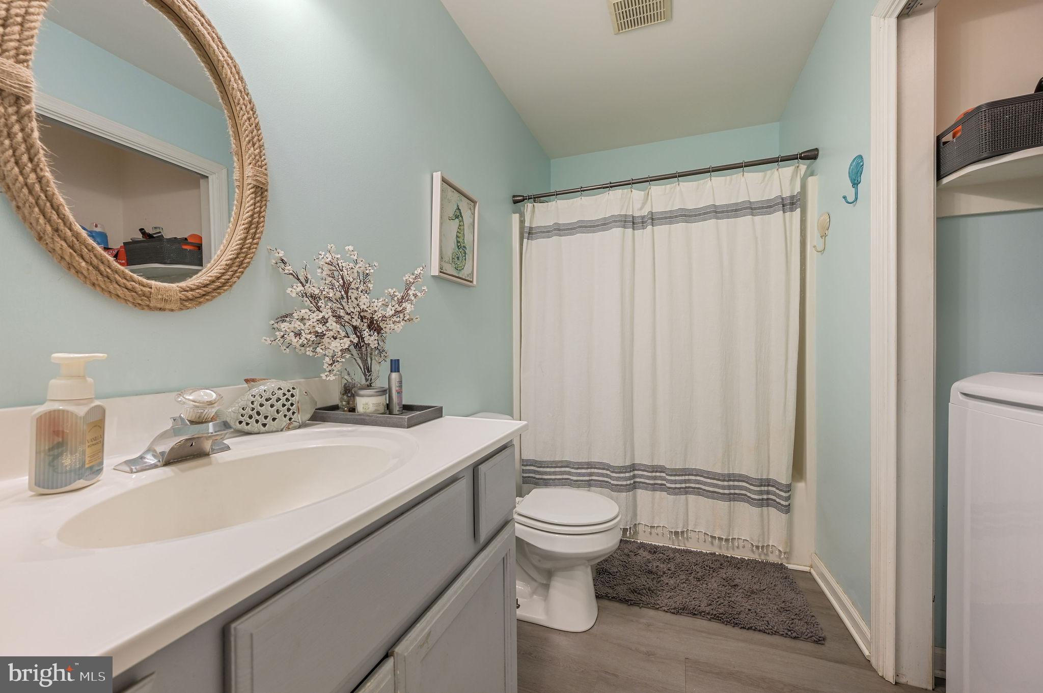 196 Mifflin Road Dover, DE 19904 - Photo 18 of 27 a bathroom with a sink a toilet and a mirror