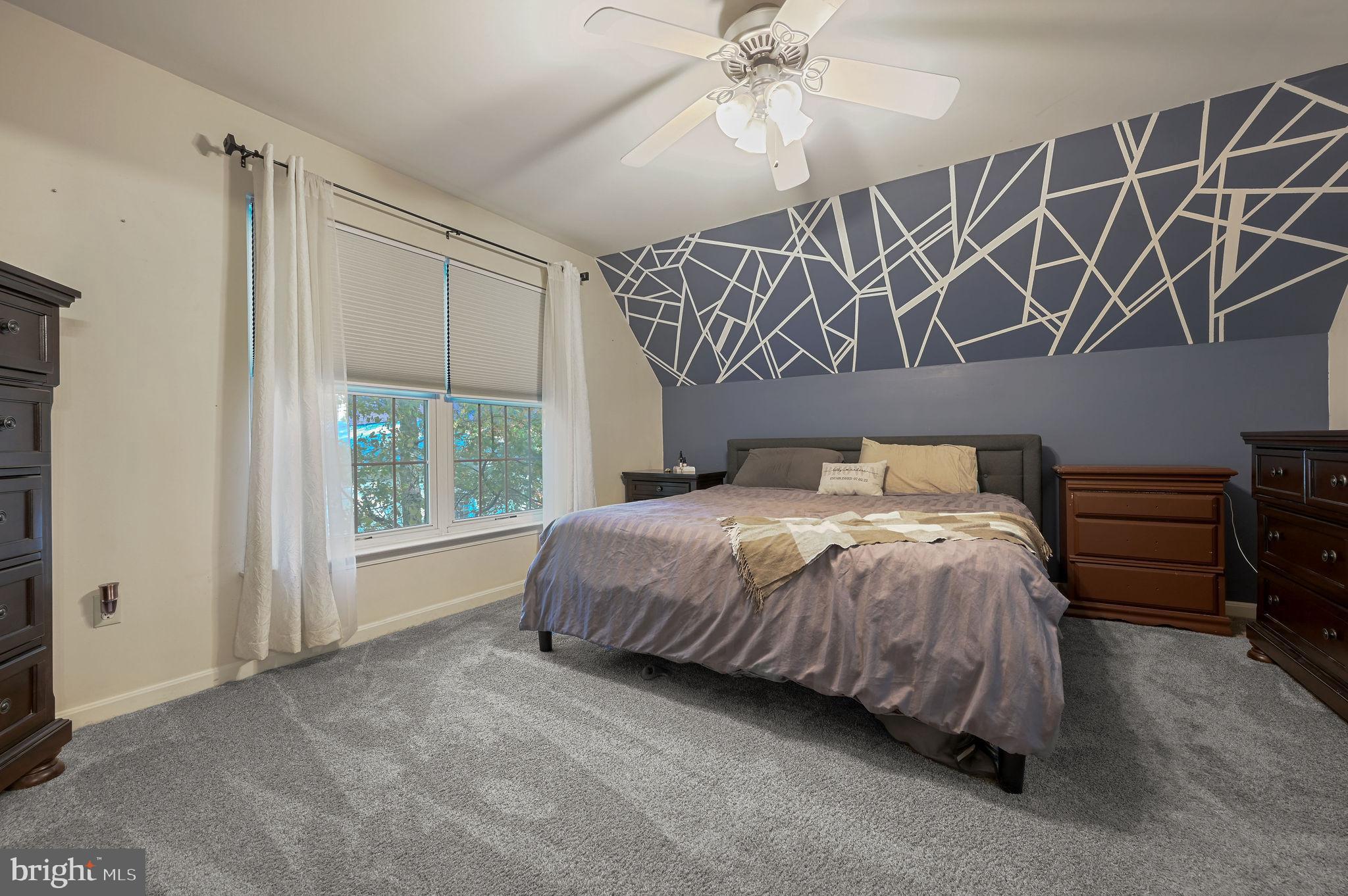 196 Mifflin Road Dover, DE 19904 - Photo 19 of 27 a bedroom with a bed and a mirror