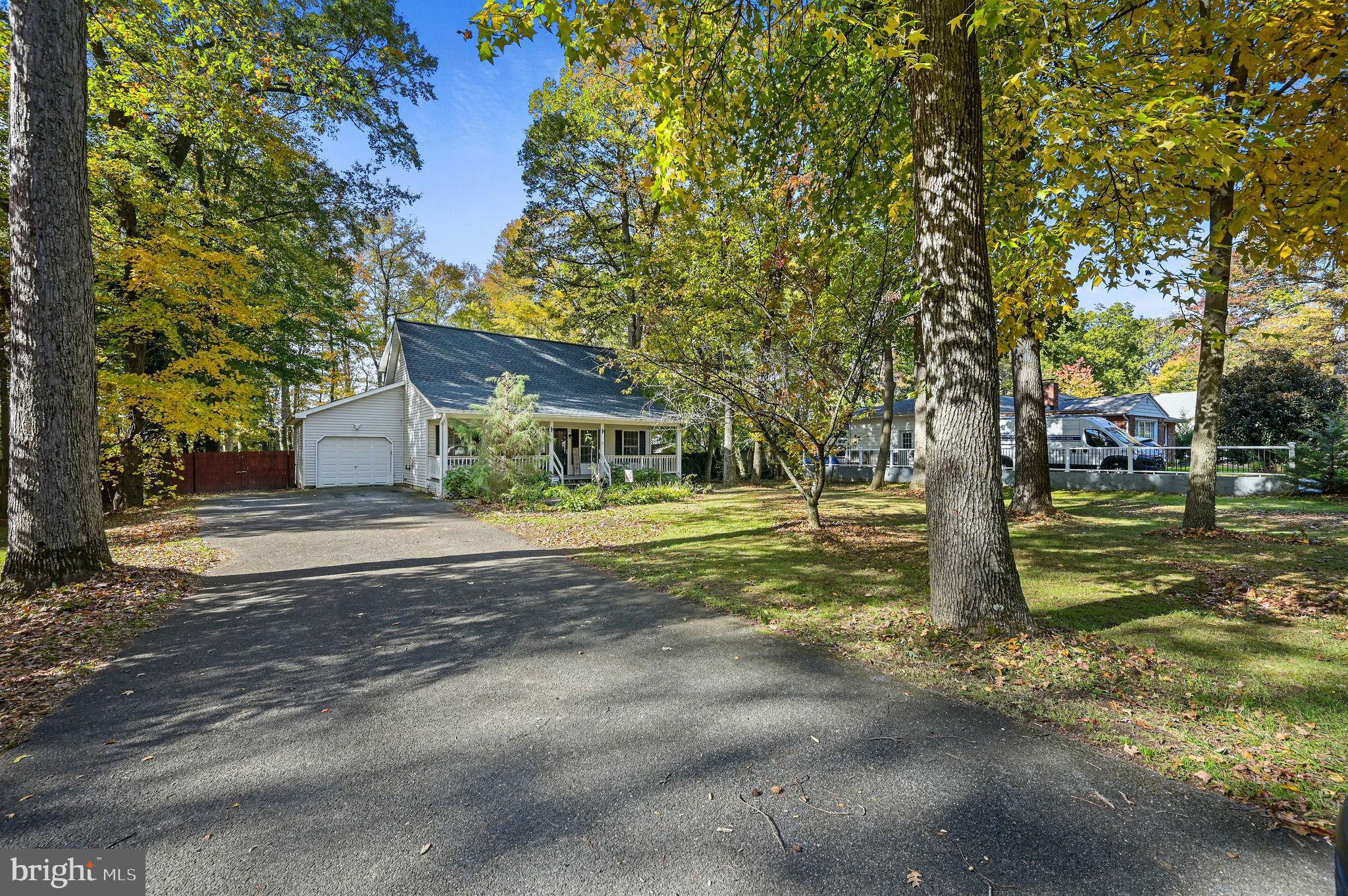 196 Mifflin Road Dover, DE 19904 - Photo 2 of 27 a view of a house with a cars park side of road