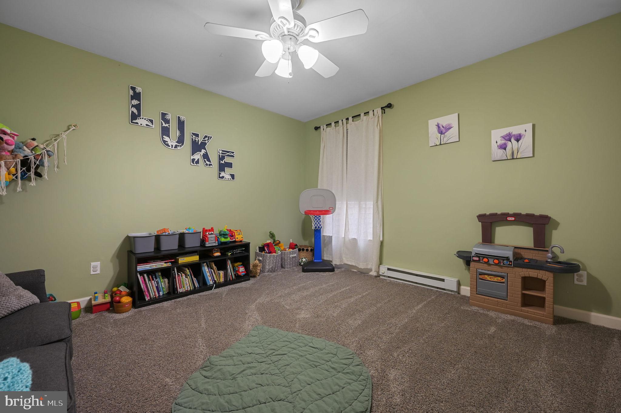 196 Mifflin Road Dover, DE 19904 - Photo 21 of 27 a bed room with a bed and a chair