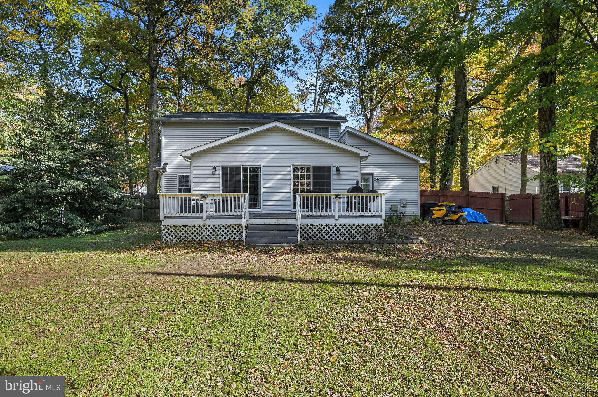 196 Mifflin Road Dover, DE 19904 - Photo 24 of 27 a view of a house with a big yard and large trees
