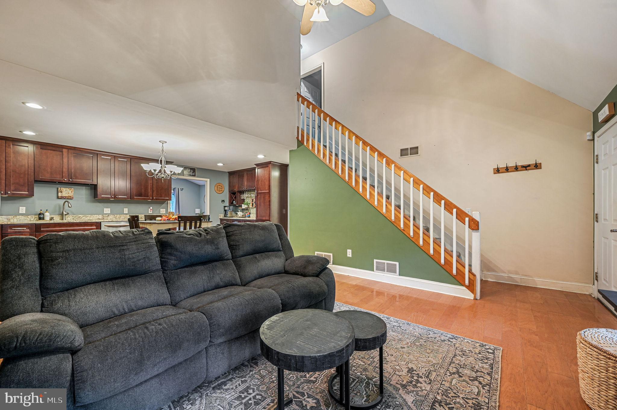 196 Mifflin Road Dover, DE 19904 - Photo 4 of 27 a living room with furniture and a dining table with wooden floor