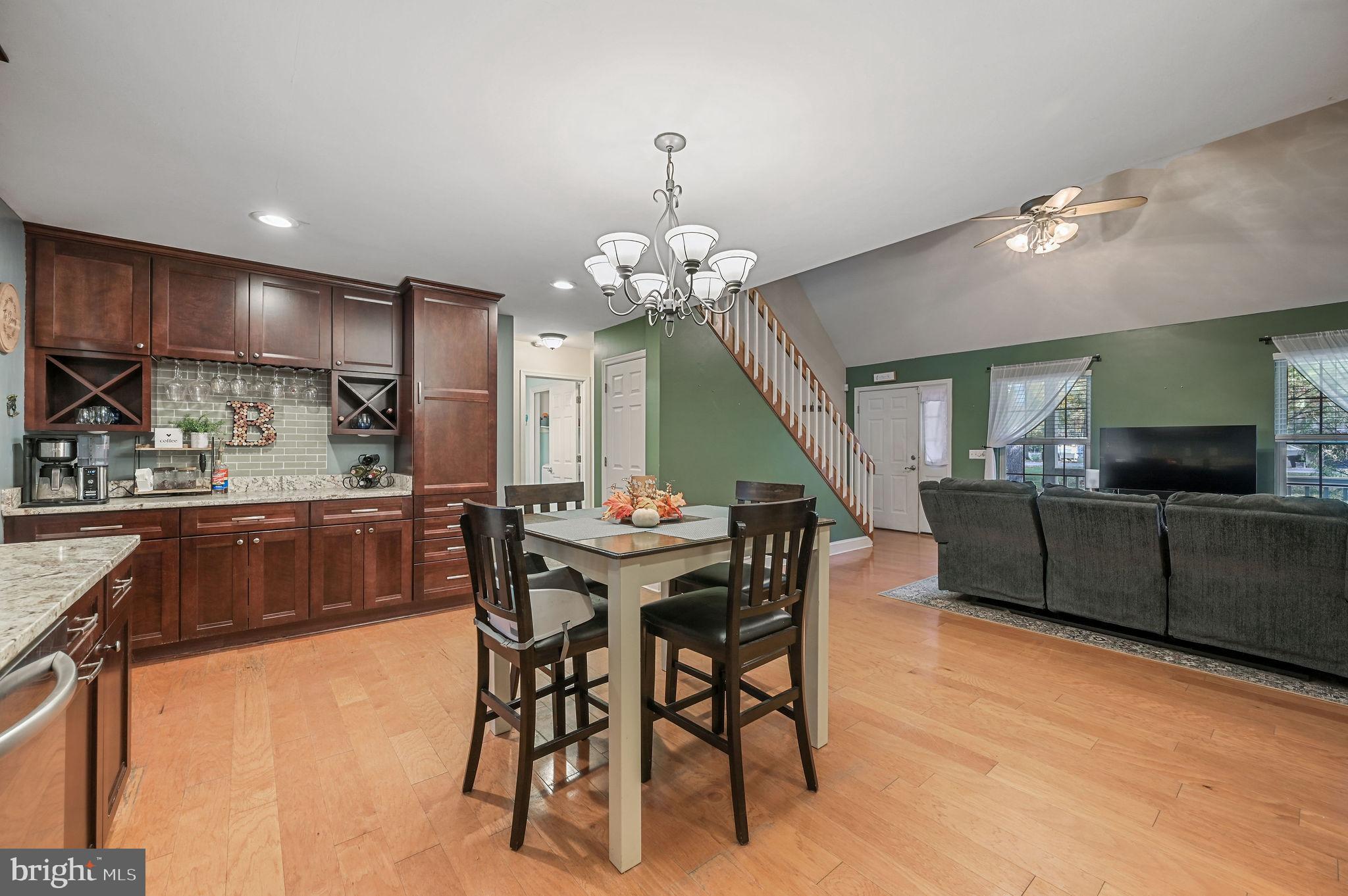 196 Mifflin Road Dover, DE 19904 - Photo 10 of 27 a view of a dining room with furniture and a chandelier