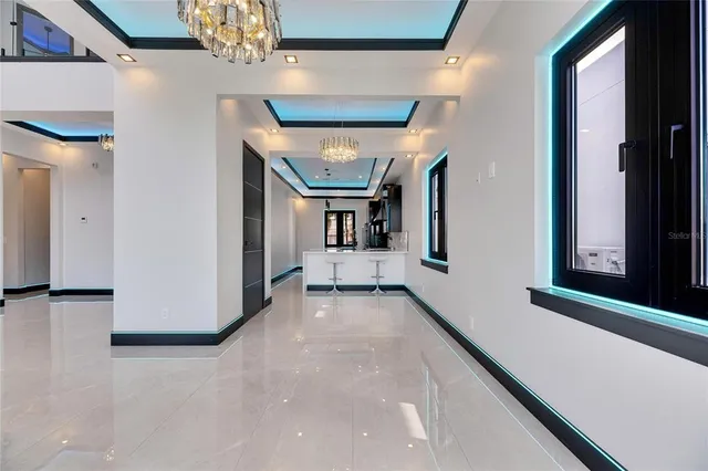 a kitchen with stainless steel appliances a stove a sink and a refrigerator