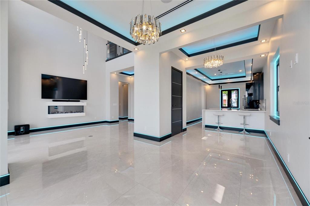 6538 Simone Shores Circle Apollo Beach, FL 33572 - Photo 14 of 88 a view of a livingroom with an empty space and a fireplace