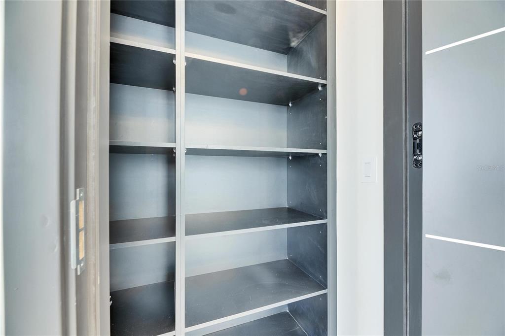 6538 Simone Shores Circle Apollo Beach, FL 33572 - Photo 22 of 88 a view of walk in closet with empty racks