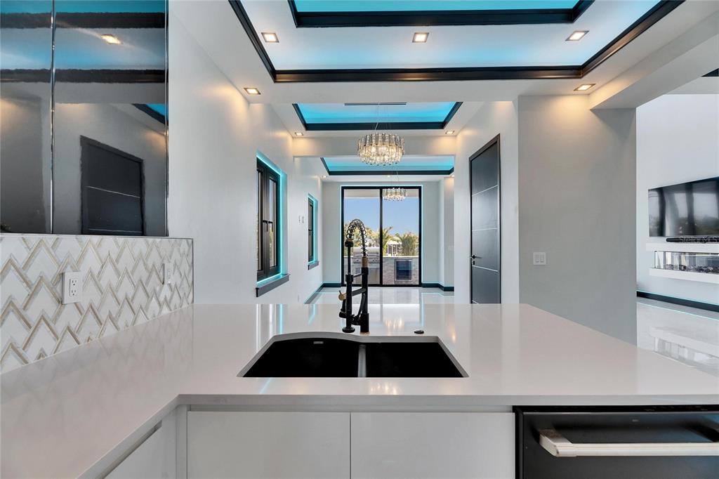 6538 Simone Shores Circle Apollo Beach, FL 33572 - Photo 28 of 88 a kitchen with a sink and refrigerator