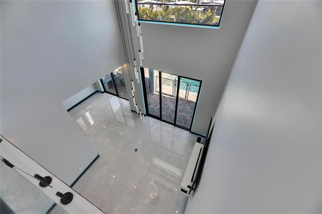 6538 Simone Shores Circle Apollo Beach, FL 33572 - Photo 48 of 88 a view of staircase with white walls and a window