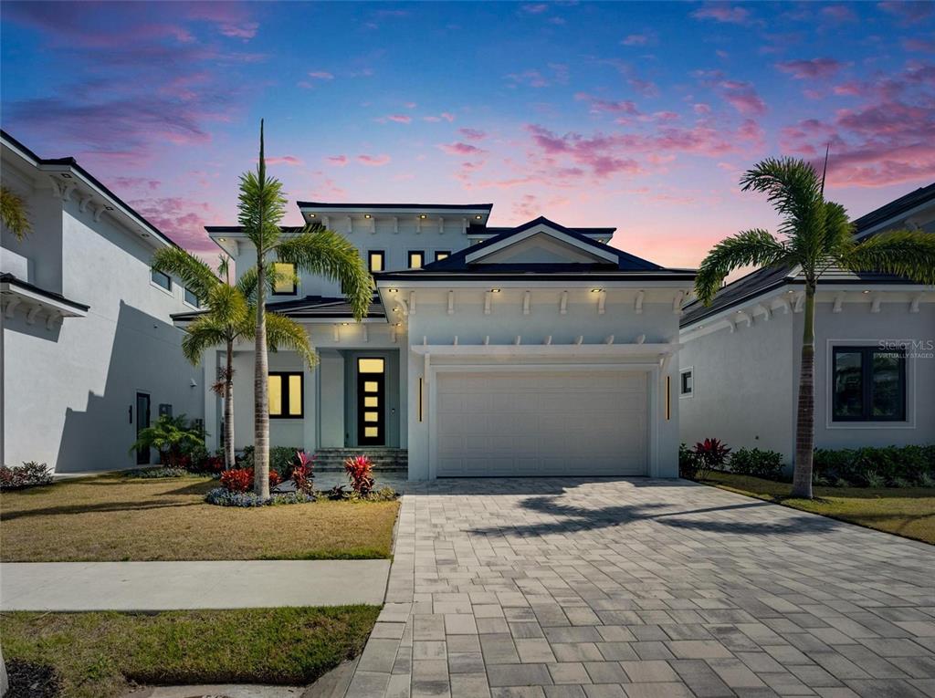 6538 Simone Shores Circle Apollo Beach, FL 33572 - Photo 80 of 88 a front view of a house with a yard and garage
