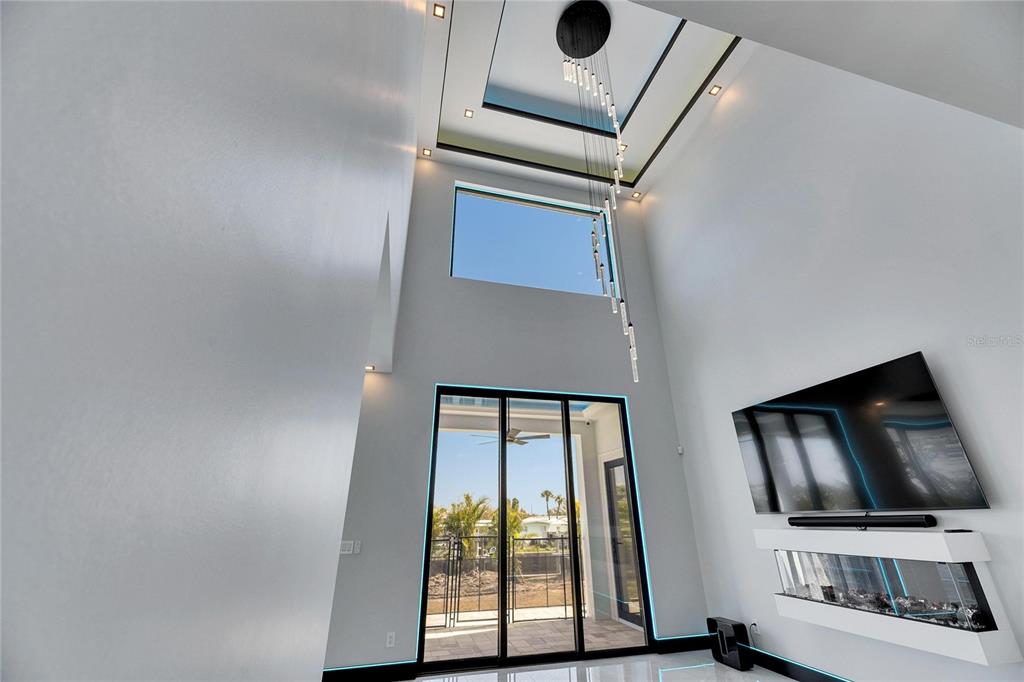 6538 Simone Shores Circle Apollo Beach, FL 33572 - Photo 10 of 88 a living room with a flat screen tv and a window