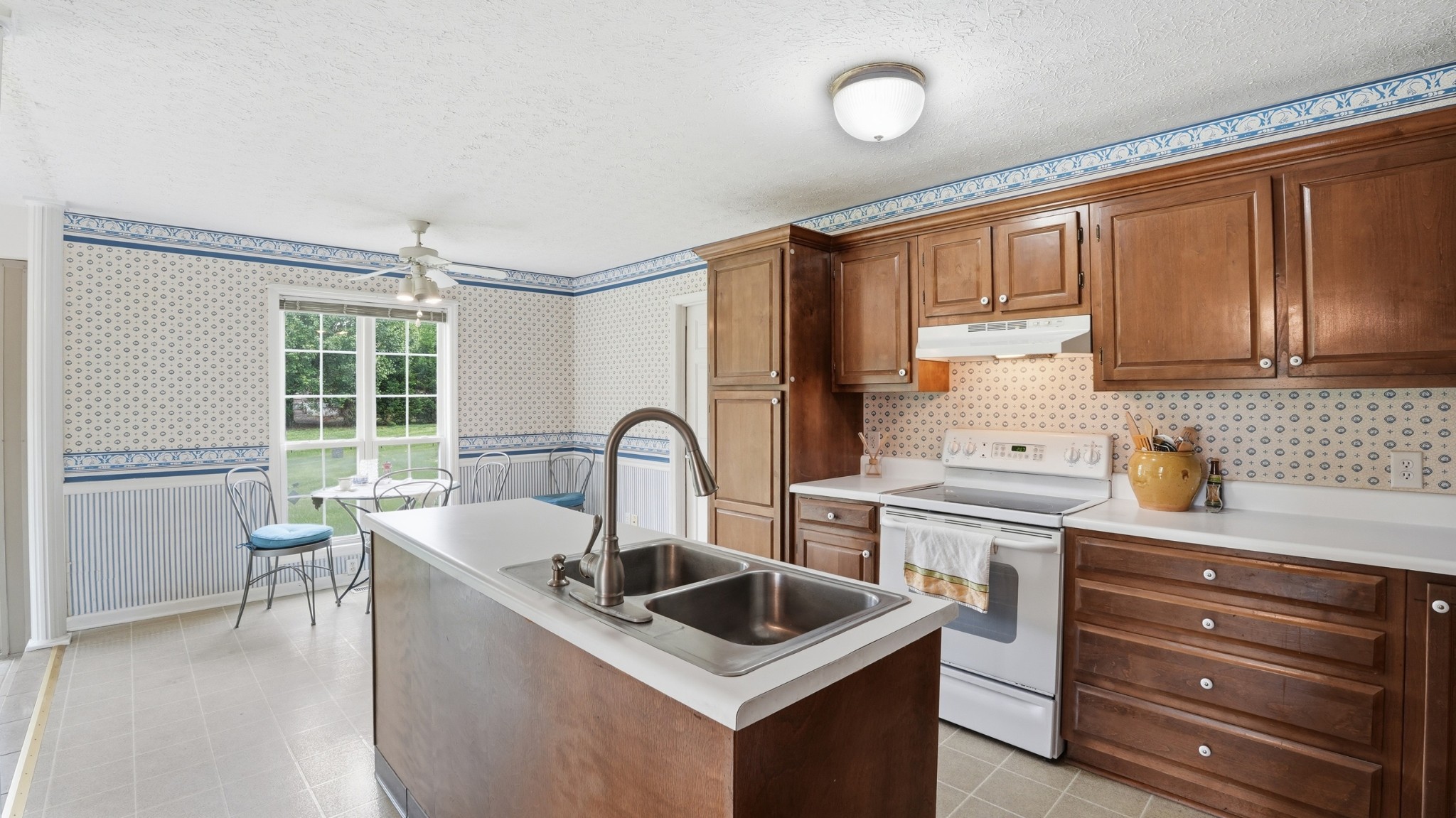213 Maple Springs Drive Manchester, TN 37355 - Photo 14 of 58 a kitchen with granite countertop a sink stainless steel appliances and cabinets