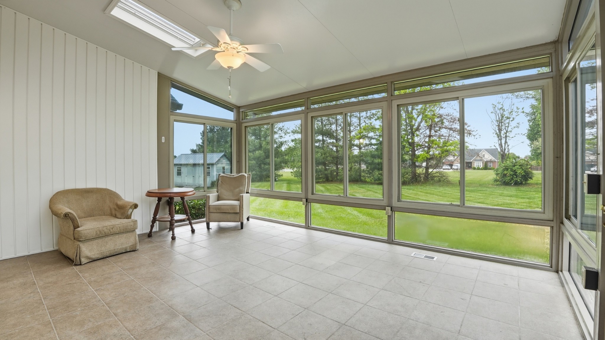 213 Maple Springs Drive Manchester, TN 37355 - Photo 19 of 58 a view of a livingroom with workspace and a ceiling fan