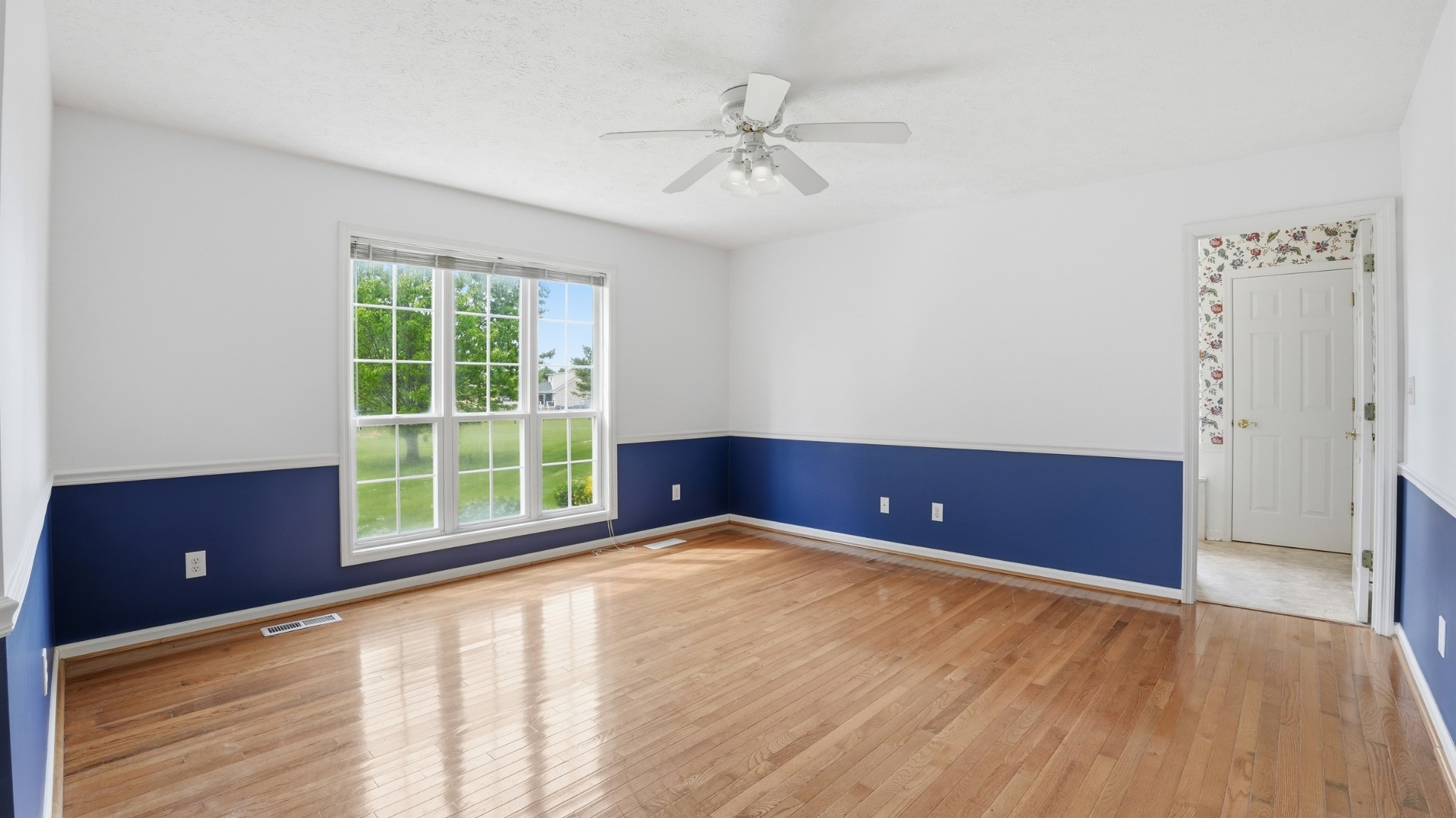 213 Maple Springs Drive Manchester, TN 37355 - Photo 27 of 58 a view of an empty room with a window and wooden floor