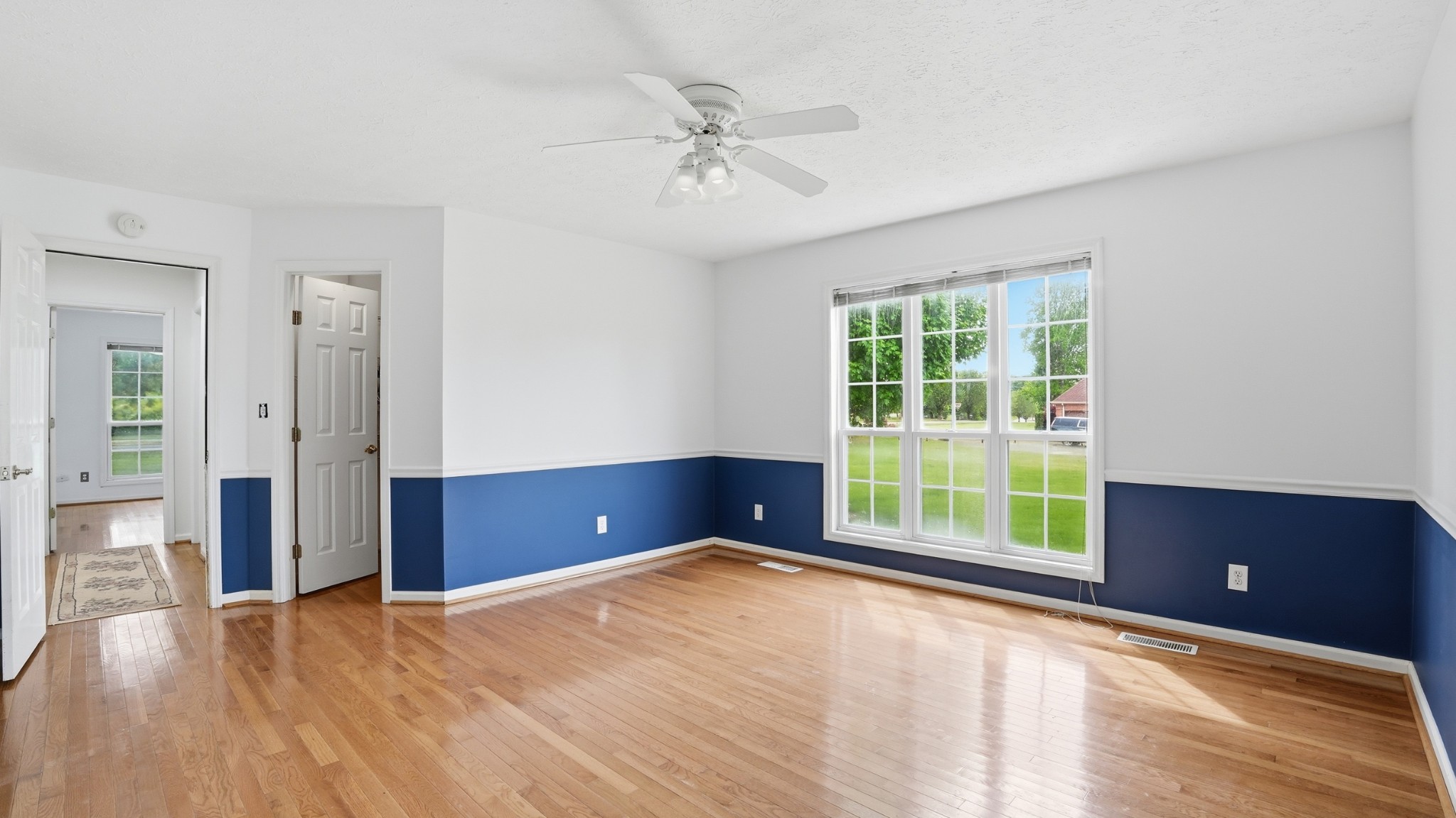 213 Maple Springs Drive Manchester, TN 37355 - Photo 28 of 58 a view of an empty room with a window and wooden floor
