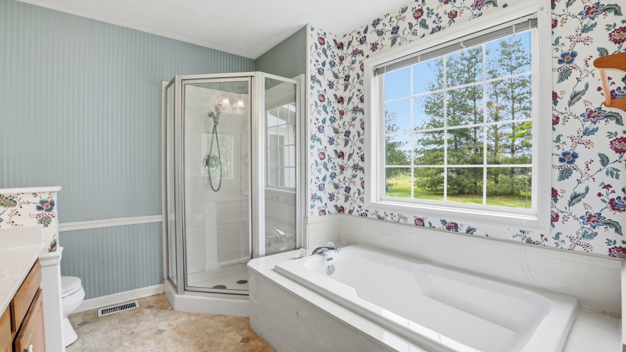 213 Maple Springs Drive Manchester, TN 37355 - Photo 30 of 58 a bathroom with a bathtub and a shower