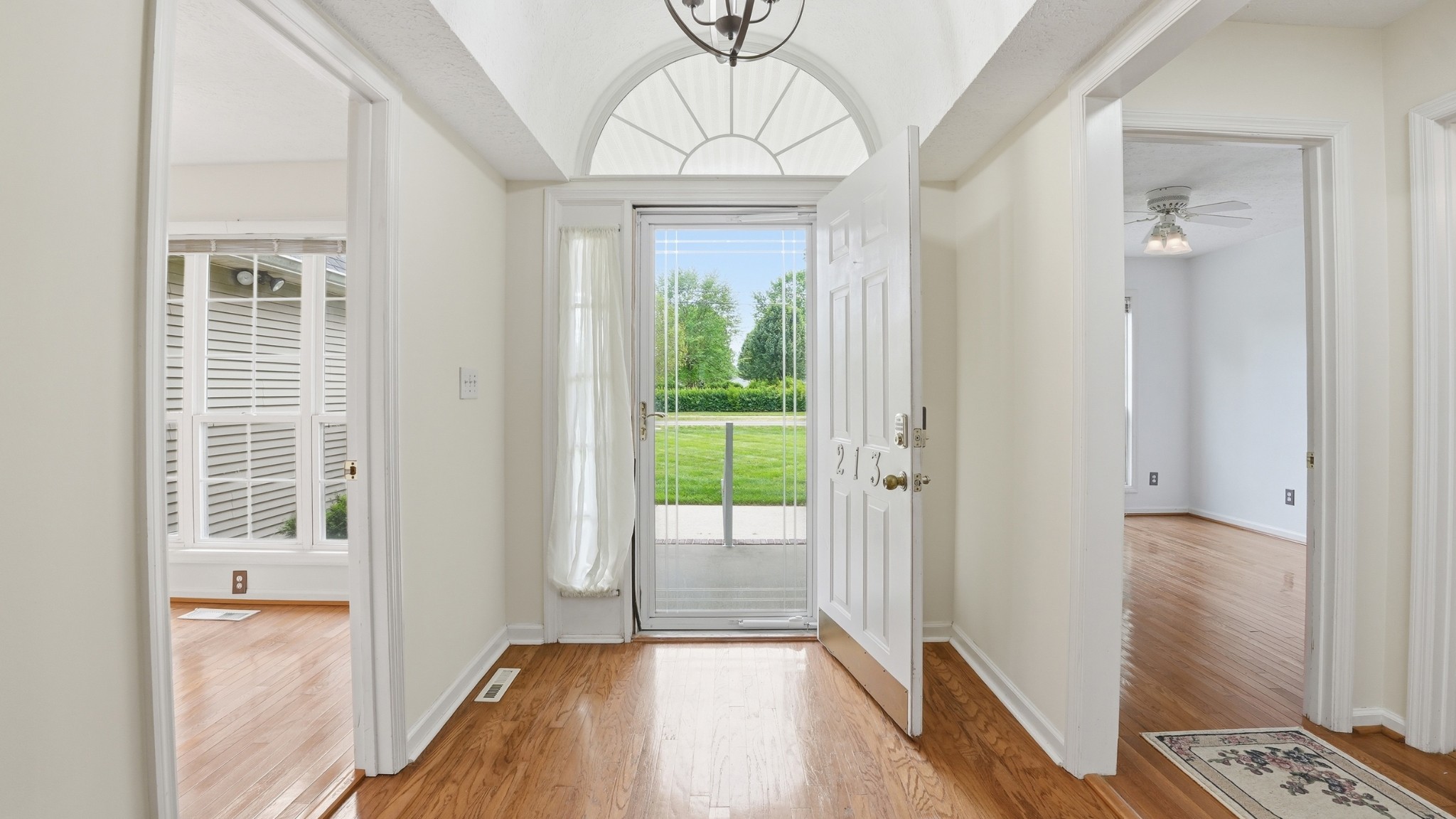 213 Maple Springs Drive Manchester, TN 37355 - Photo 4 of 58 a view of a hallway with wooden floor and a dining room