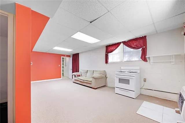 an entryway with a bed and a couch