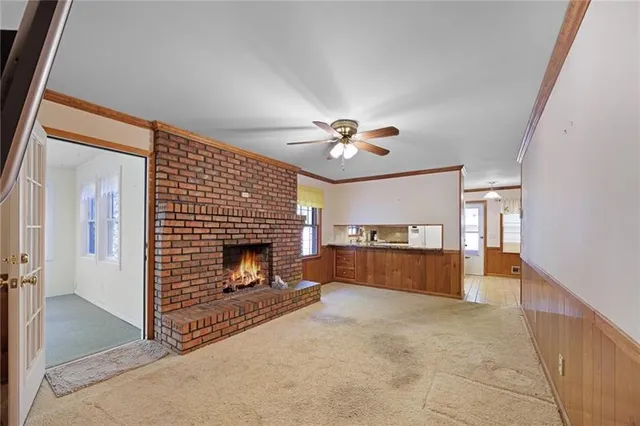 a view of a livingroom with a fireplace and furniture