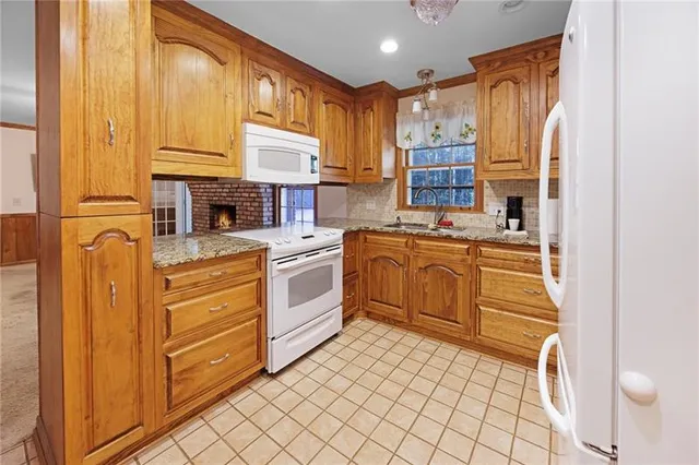 a kitchen with cabinets and window