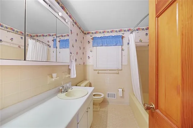 a bathroom with a sink a mirror and a shower