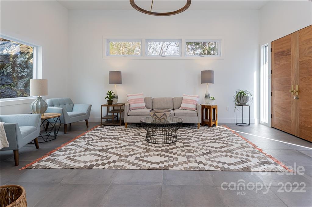 170 South Delano Road Asheville, NC 28805 - Photo 11 of 48 a living room with furniture and a rug