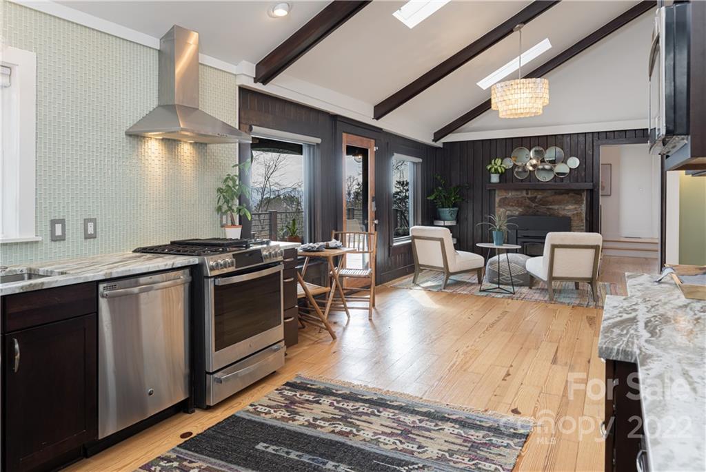 170 South Delano Road Asheville, NC 28805 - Photo 17 of 48 a kitchen with stainless steel appliances granite countertop a sink stove and cabinets