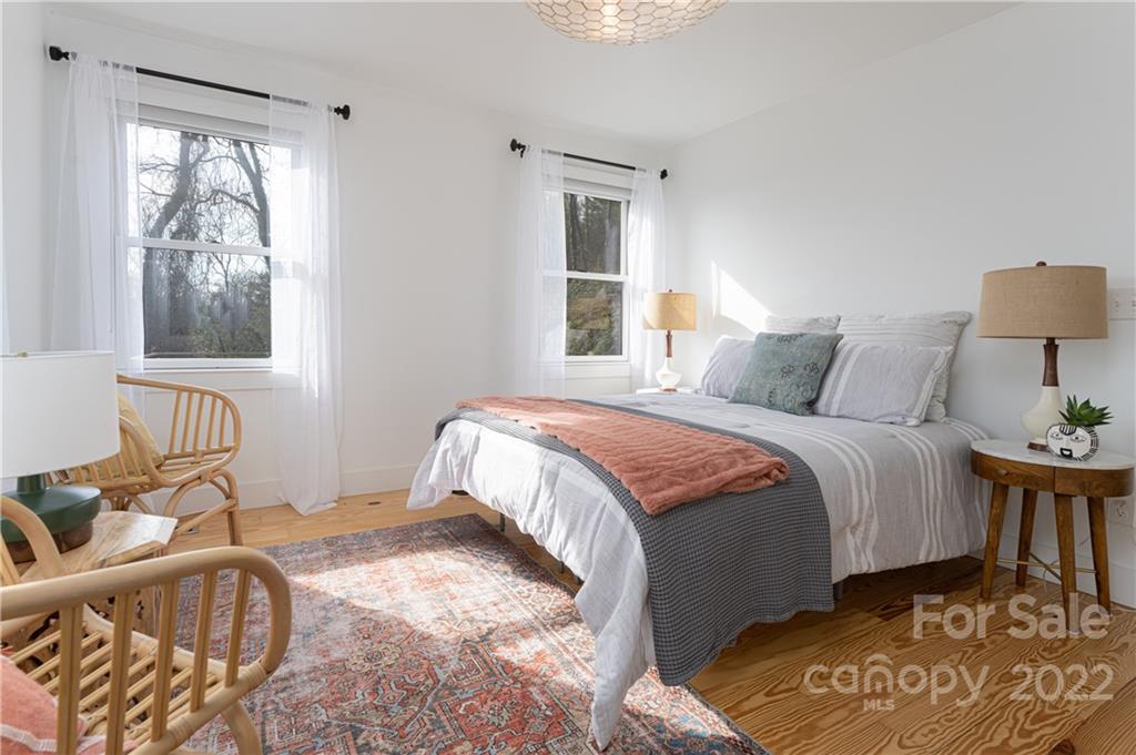 170 South Delano Road Asheville, NC 28805 - Photo 24 of 48 a bedroom with a bed and wooden floor