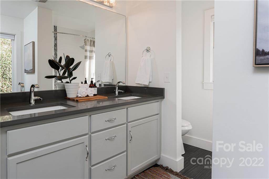 170 South Delano Road Asheville, NC 28805 - Photo 26 of 48 a bathroom with a sink and a mirror
