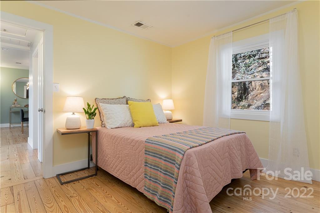 170 South Delano Road Asheville, NC 28805 - Photo 35 of 48 a bedroom with a bed and a painting