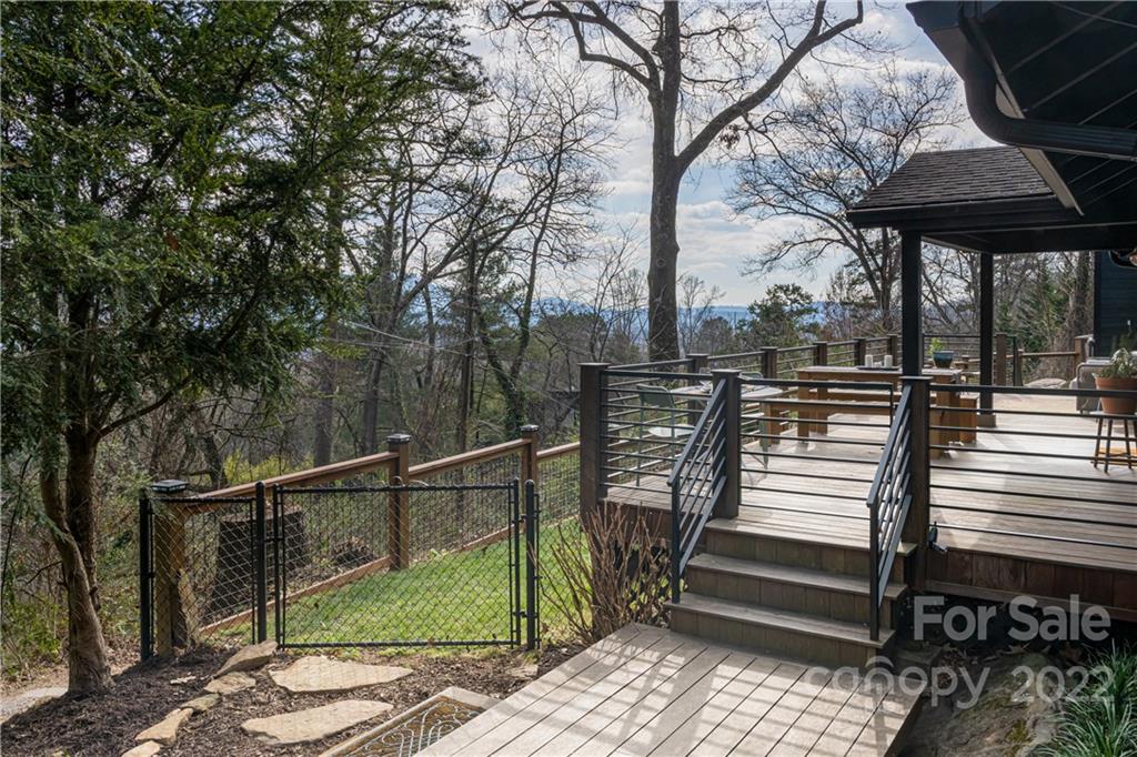 170 South Delano Road Asheville, NC 28805 - Photo 40 of 48 a view of a wooden deck with a bench and wooden floor