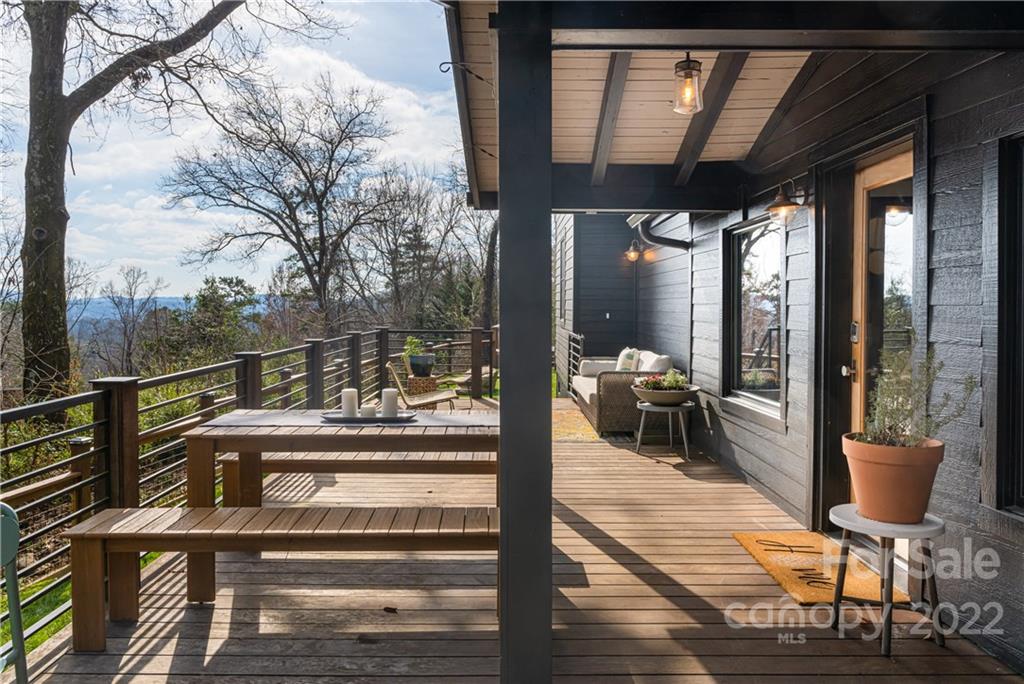 170 South Delano Road Asheville, NC 28805 - Photo 42 of 48 a view of a balcony with chair and wooden floor