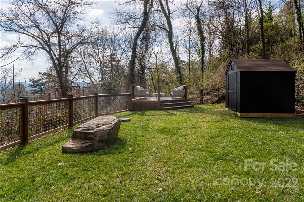 170 South Delano Road Asheville, NC 28805 - Photo 46 of 48 a backyard of a house with table and chairs