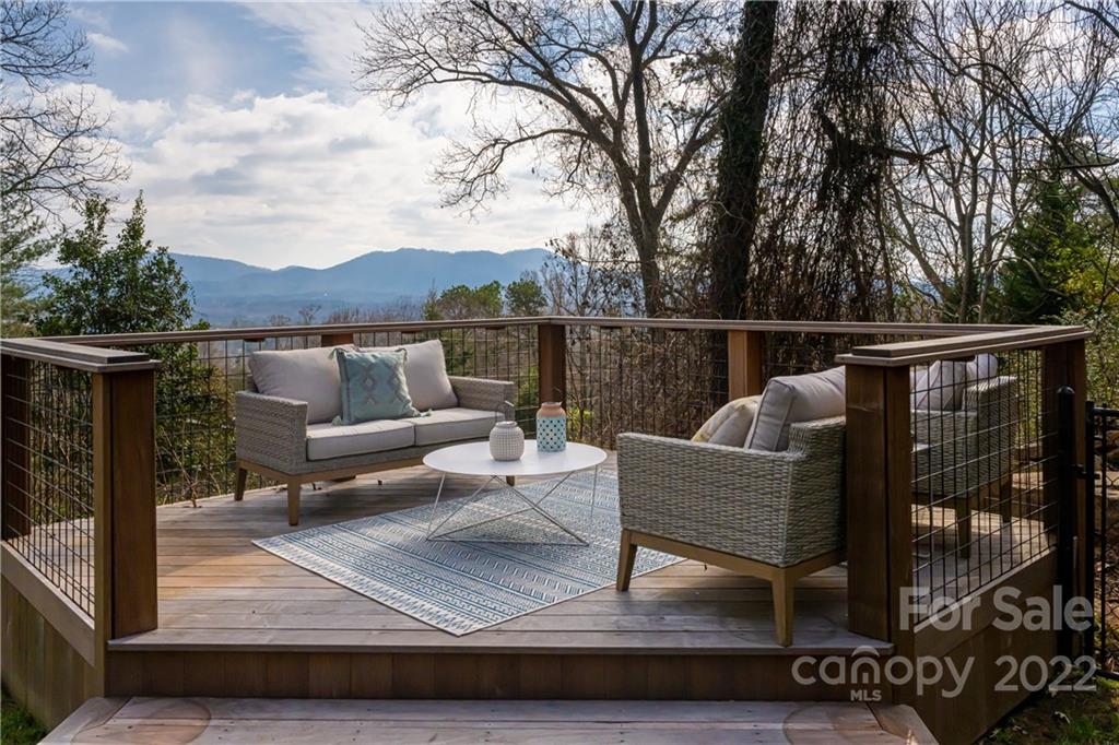 170 South Delano Road Asheville, NC 28805 - Photo 5 of 48 a view of couch on wooden deck with mountain view