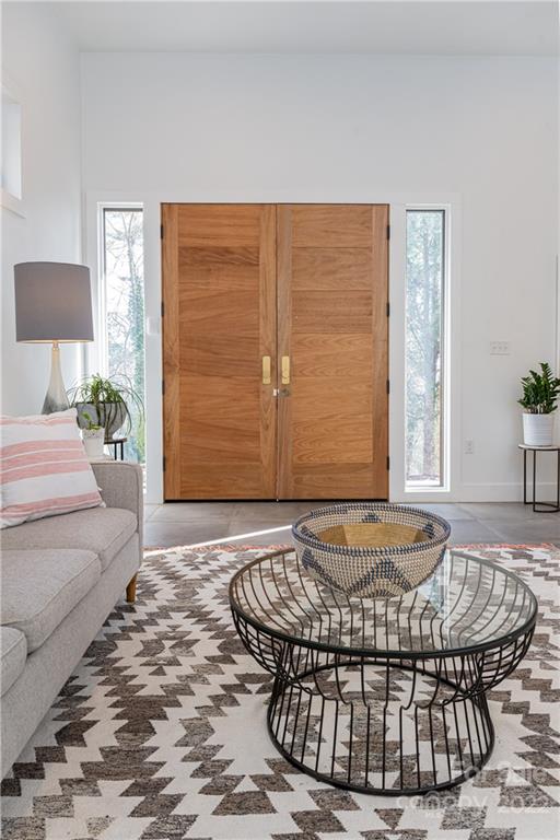170 South Delano Road Asheville, NC 28805 - Photo 8 of 48 a living room with a couch and a table