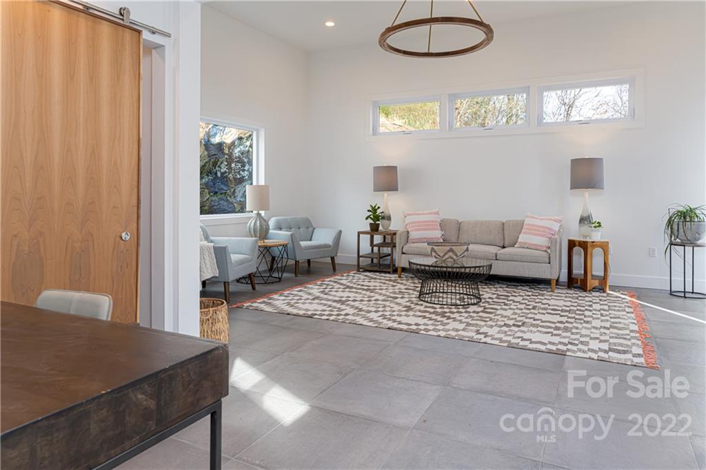 170 South Delano Road Asheville, NC 28805 - Photo 9 of 48 a living room with furniture and a large window